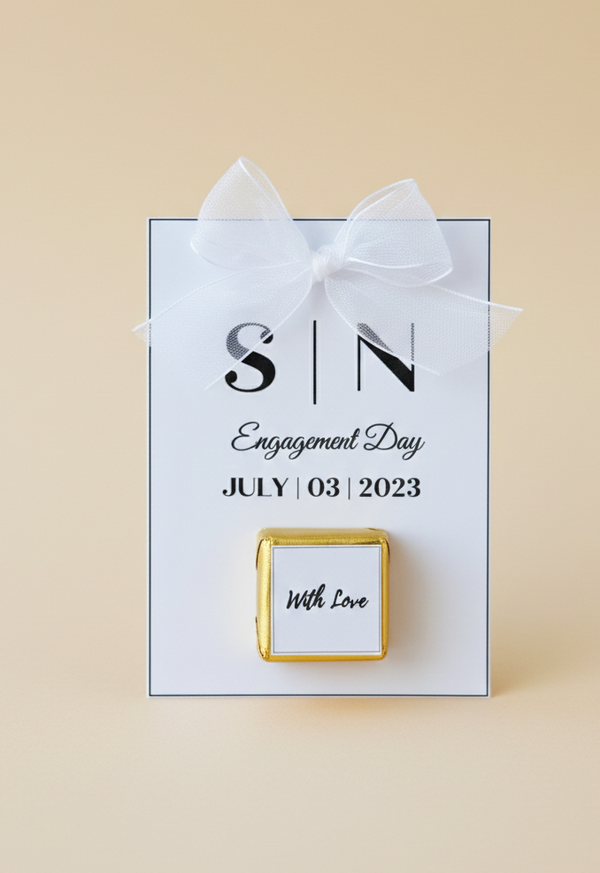Gift box with a white ribbon and personalized message on a beige background
