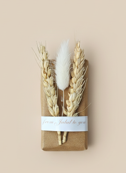 Dried plants on a brown box with a beige background