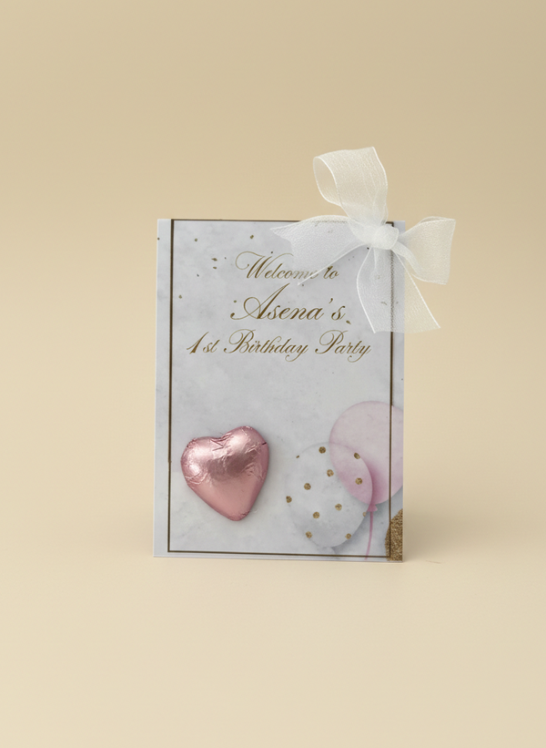 Gift box with pink heart and white bow on a beige background