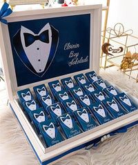 Celebrate the groom’s special day with our elegant blue-themed 24-piece chocolate gift box! 🍫✨ Customized with his name, this luxurious set is perfect for engagements, weddings, or unique celebrations. 🎁🤵 A premium gift designed to add a touch of sophistication and sweetness to the groom’s memorable moments. 🌟