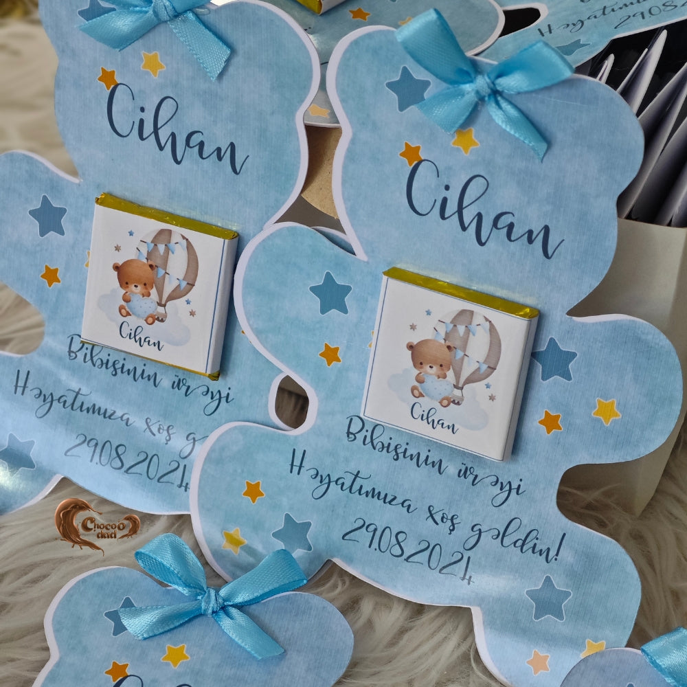 Celebrate the arrival of your baby boy with our adorable blue teddy bear-shaped chocolate card