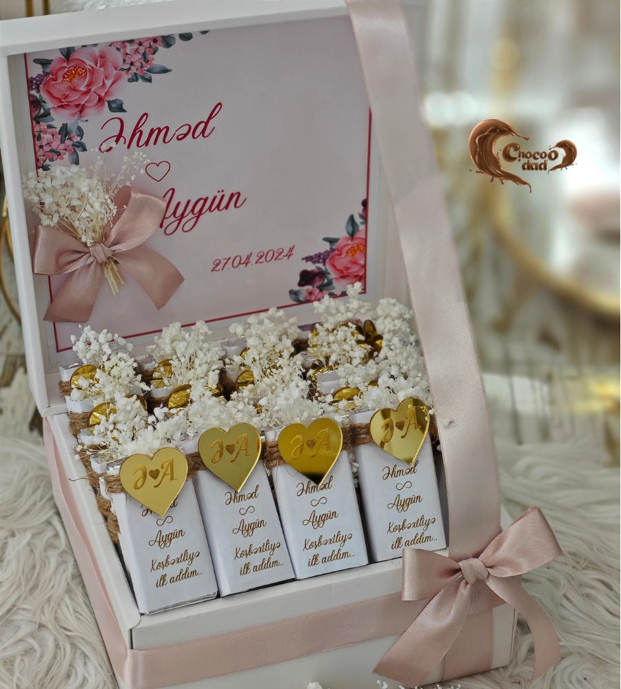 Celebrate the beginning of a beautiful journey with 20 elegantly designed chocolates in a customized box, perfect for sharing on engagement or wedding days.