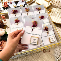 Celebrate your engagement with our handcrafted chocolates featuring a "Happy Engagement Day" message and personalized names! 💍🍫 Adorned with natural dried flowers and an elegant design, these chocolates are perfect for sharing with guests as a memorable and stylish favor. 🎁✨ Customizable to match your unique style, they add a touch of sophistication to your special day. 🌟