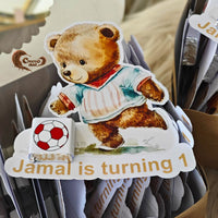 Celebrate your little one's first birthday with our adorable Football and Teddy Bear-themed chocolate cards
