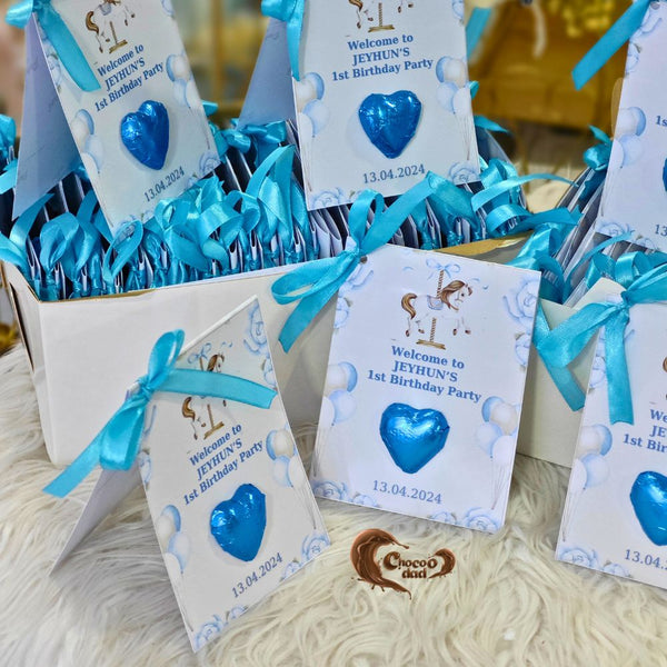 Chocolates are individually designed with a carousel theme, featuring charming details that perfectly suit a boy's first birthday celebration.
