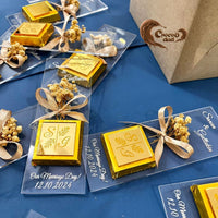 Celebrate your engagement day with our elegant chocolates adorned with natural dried flowers and bouquet designs! 🌼🍫 Featuring laser-cut custom names, these chocolates are the perfect personalized gift for your special day. 🎁✨ Ideal for engagement ceremonies, they combine beauty, sweetness, and sophistication. Add a unique touch to your celebration with these one-of-a-kind treats! 💍💖