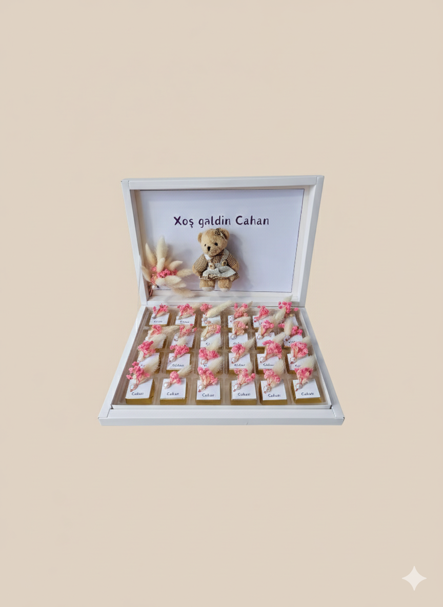 Gift box with teddy bear and small items on a beige background