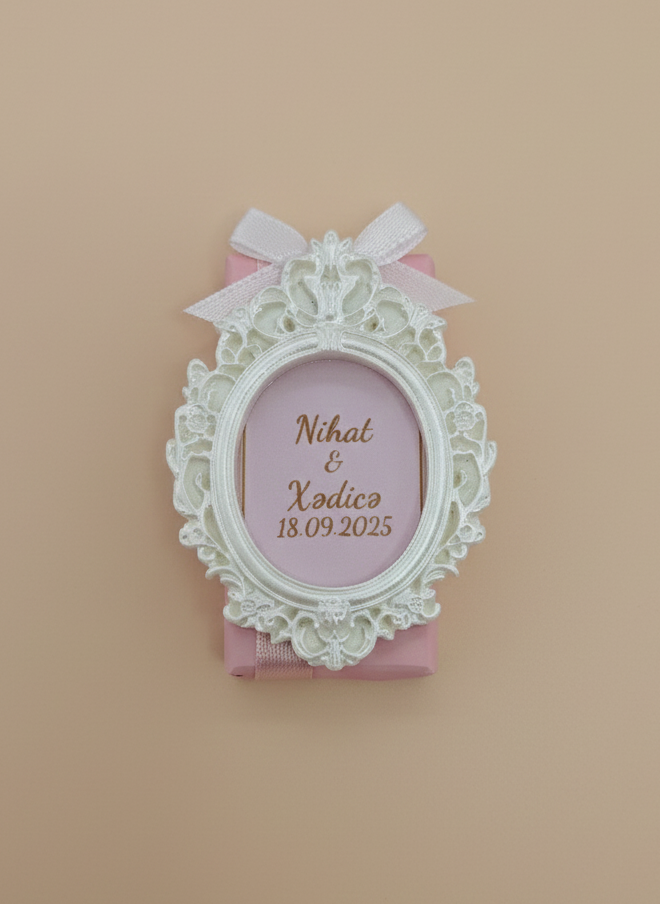 Decorative frame with a pink card inside on a beige background