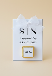 Gift box with a white ribbon and personalized message on a beige background