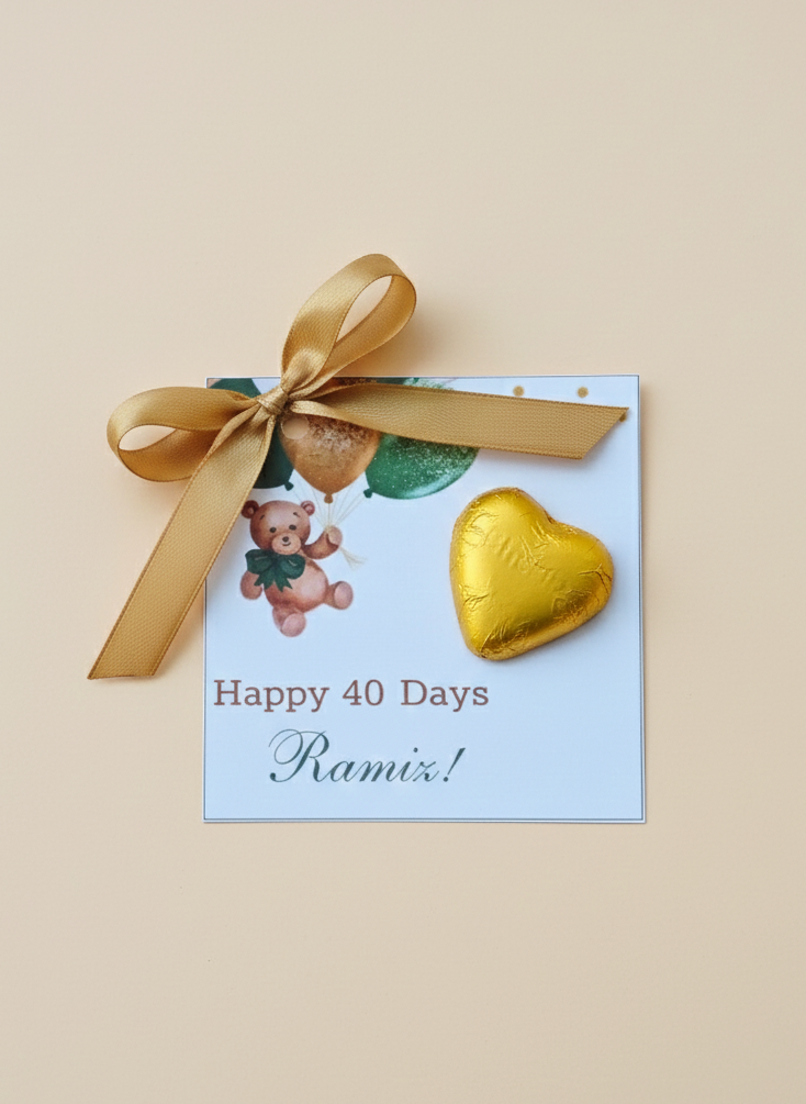 Greeting card with teddy bear, gold heart, and ribbon on a beige background