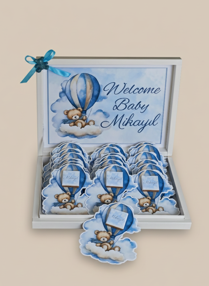 Baby shower favor with teddy bear and hot air balloon design, featuring 'Welcome Baby Mikayil' text.