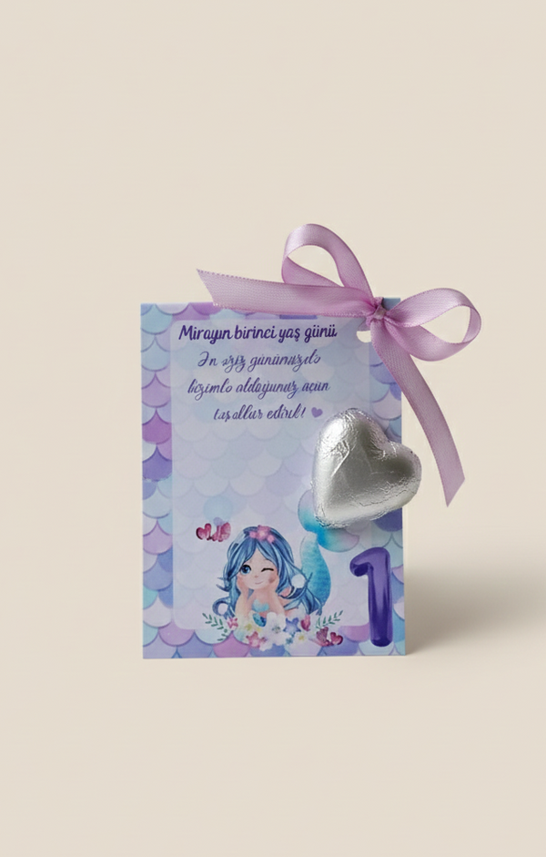 Children's birthday card with a heart-shaped balloon and ribbon on a light beige background