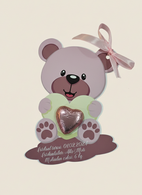 Decorative bear with a heart and pink bow on a beige background