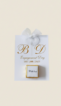 Engagement ring box with 'B D' initials and 'Engagement Day' text on a beige background