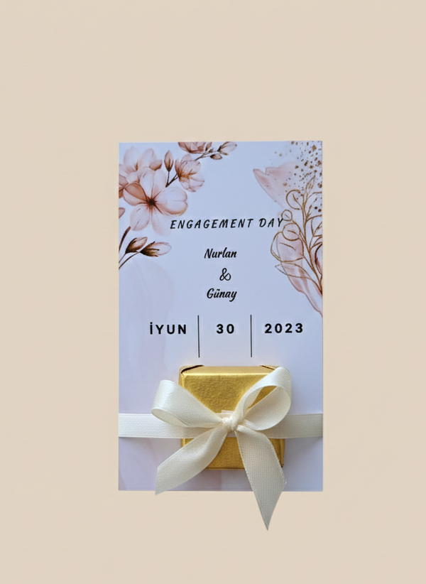 Engagement card with floral design and gold box on a beige background