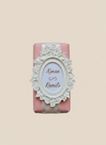 Decorative chocolate bar with ornate design and text on a beige background