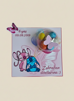 Children's birthday card with cartoon character, balloons, and text on a light pink background