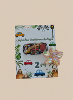Colorful card with vehicle illustrations and a decorative flower on a beige background