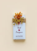 Personalized chocolate mini bar with flowers and text on a beige background