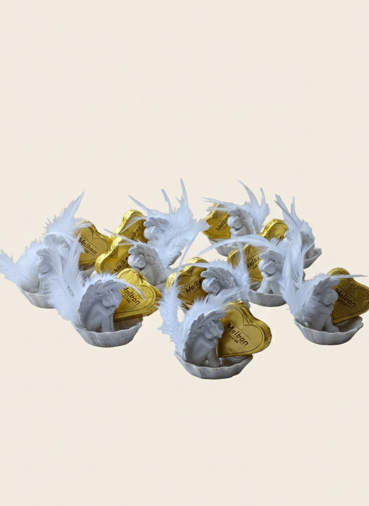 Decorative items with white antler-like structures and gold centers on a beige background