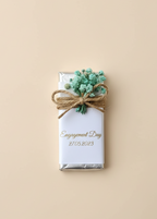 Decorative chocolate bar with a small plant on a beige background