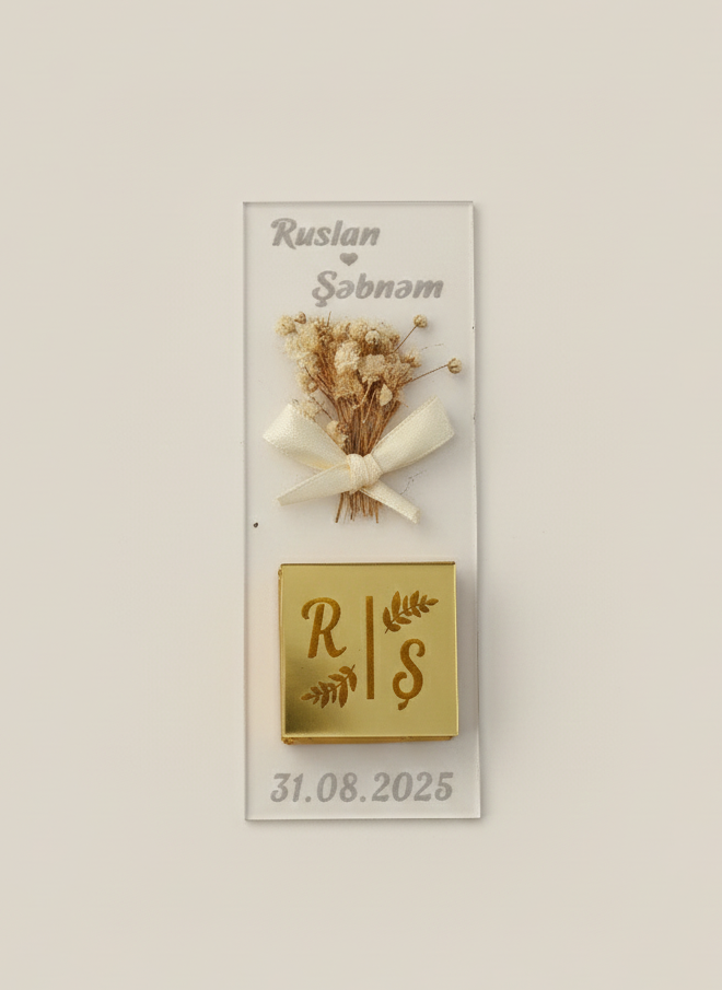 Decorative wall plaque with dried flowers, a bow, and personalized text on a light background