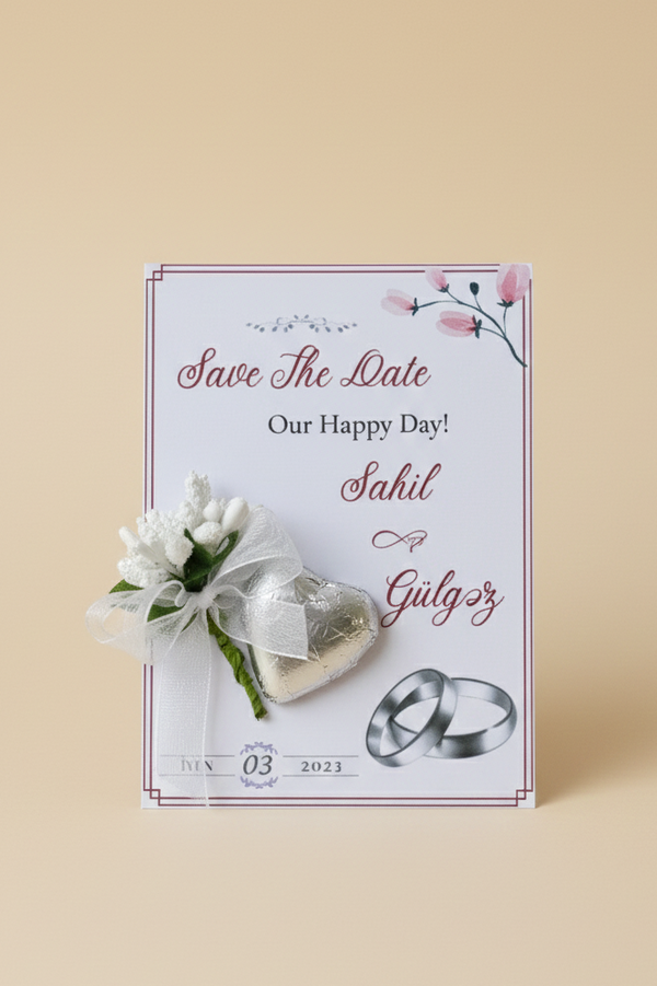 Save the Date card with wedding rings and flowers on a beige background
