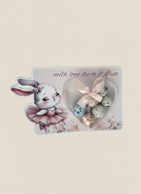 Decorative card with a bunny, eggs, and flowers on a beige background