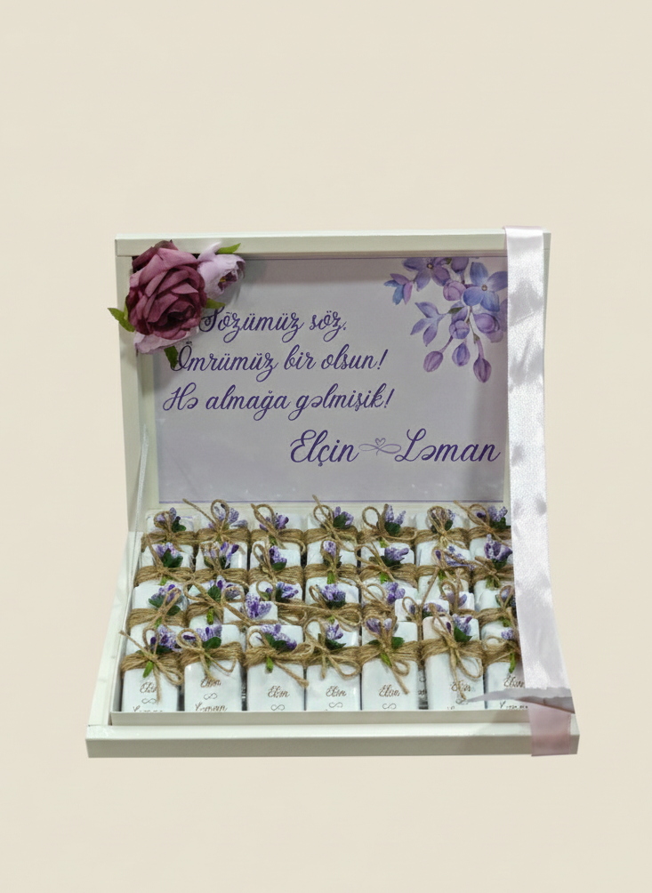 Packaged chocolates with floral design and text on a beige background