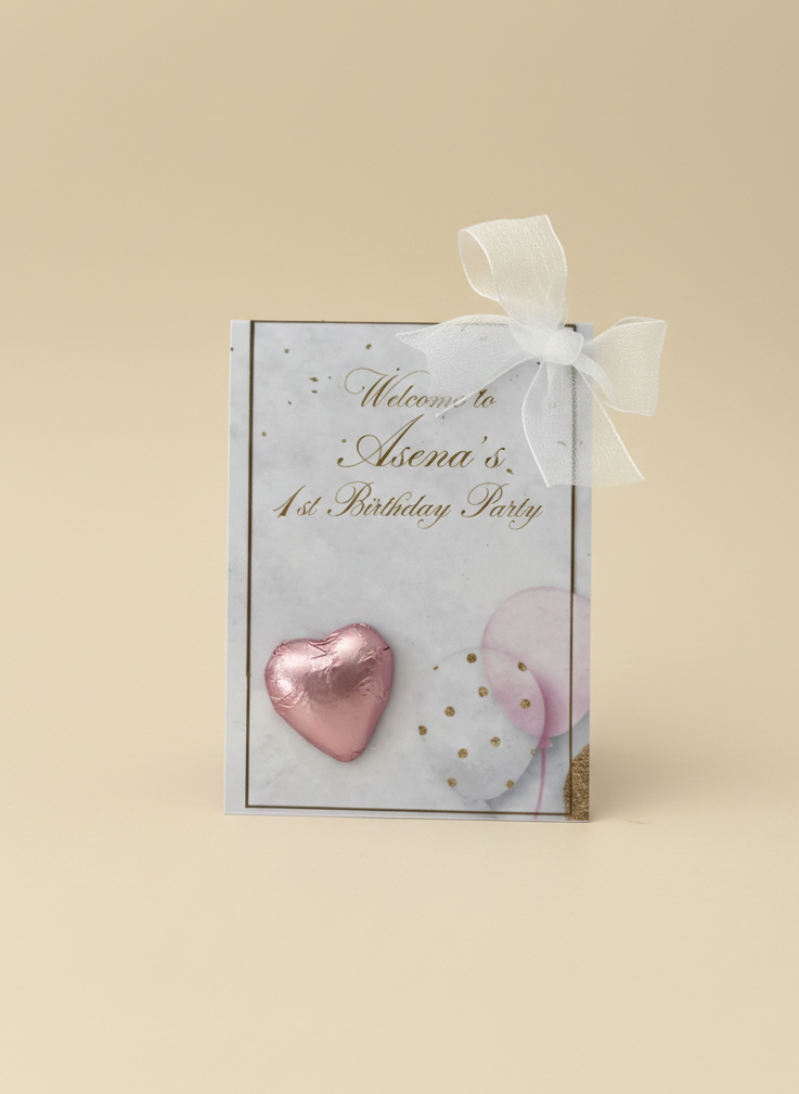 Gift box with pink heart and white bow on a beige background