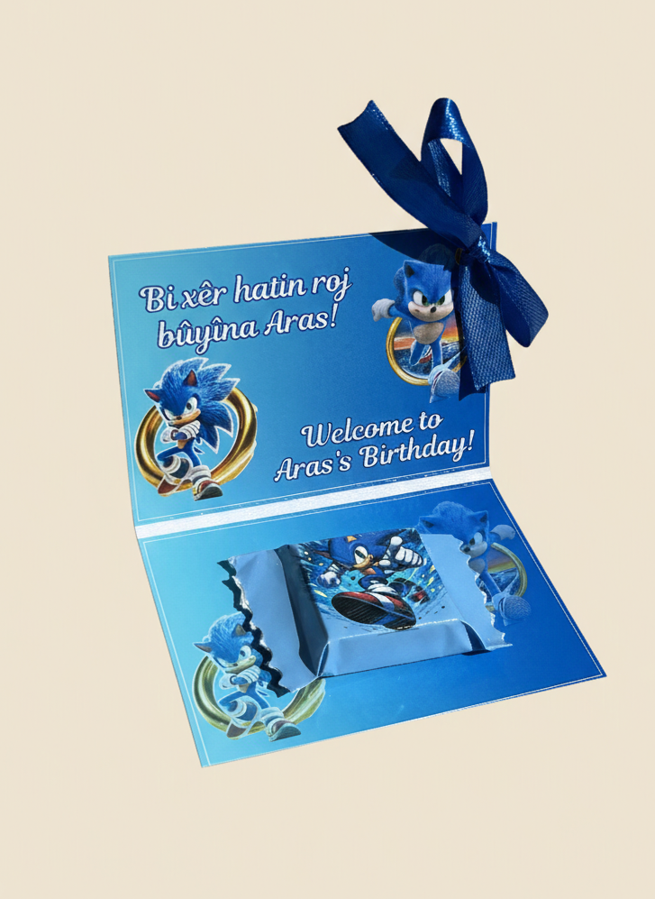 Blue birthday card with cartoon characters and a ribbon on a beige background