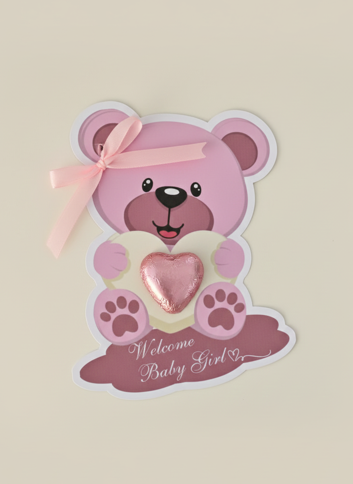 Pink teddy bear with a heart and 'Welcome Baby Girl' text on a beige background