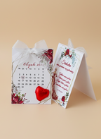 Calendar with floral design and red heart on a beige background