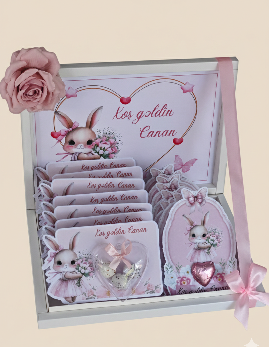 Decorative box with cartoon rabbit design and pink rose on beige background
