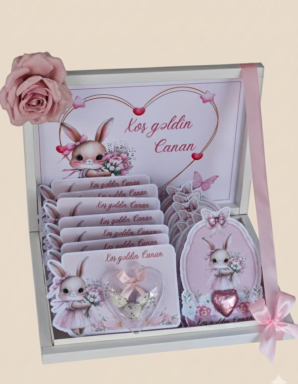 Decorative box with cartoon rabbit design and pink rose on beige background