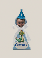 Child's birthday hat with dinosaur design and name 'Osman' on a plain background
