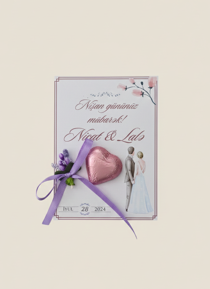 Wedding invitation card with heart, ribbon, and couple silhouette on a light background