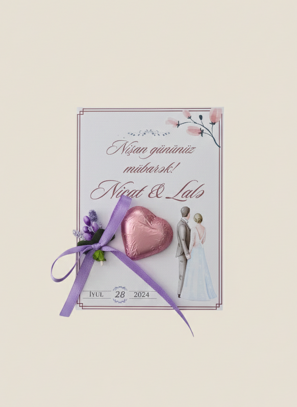 Wedding invitation card with heart, ribbon, and couple silhouette on a light background