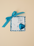 Calendar with blue heart and ribbon on a beige background