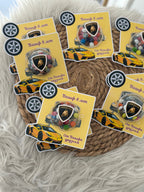 Stickers with car designs and logos on a textured surface