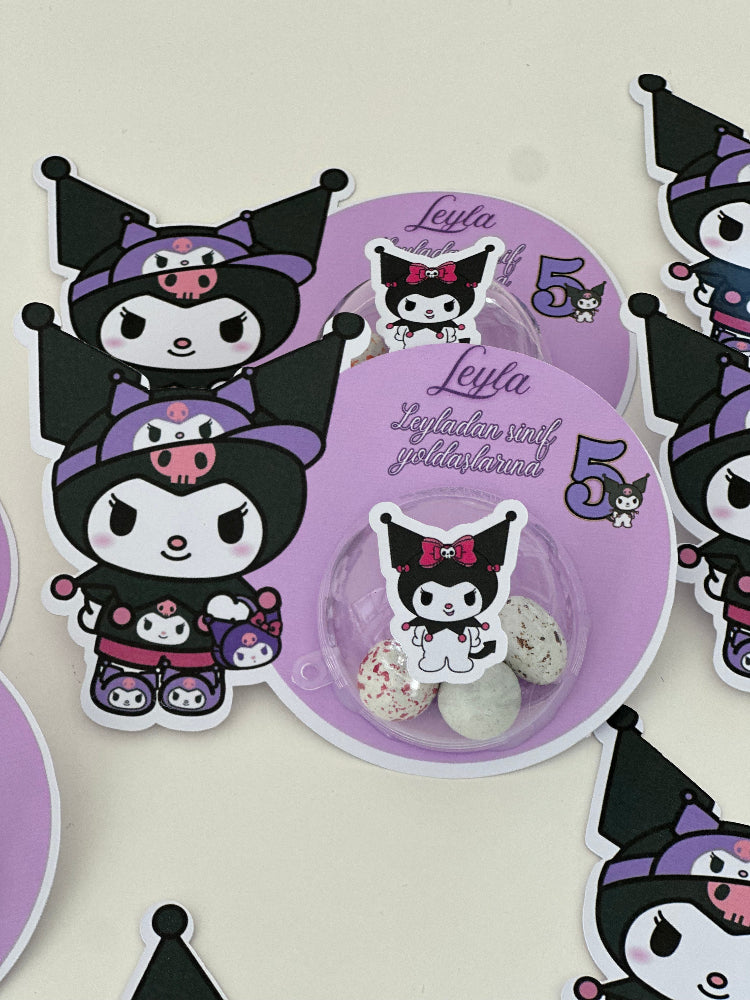 Circular purple product with cartoon cat design surrounded by similar stickers on a light background