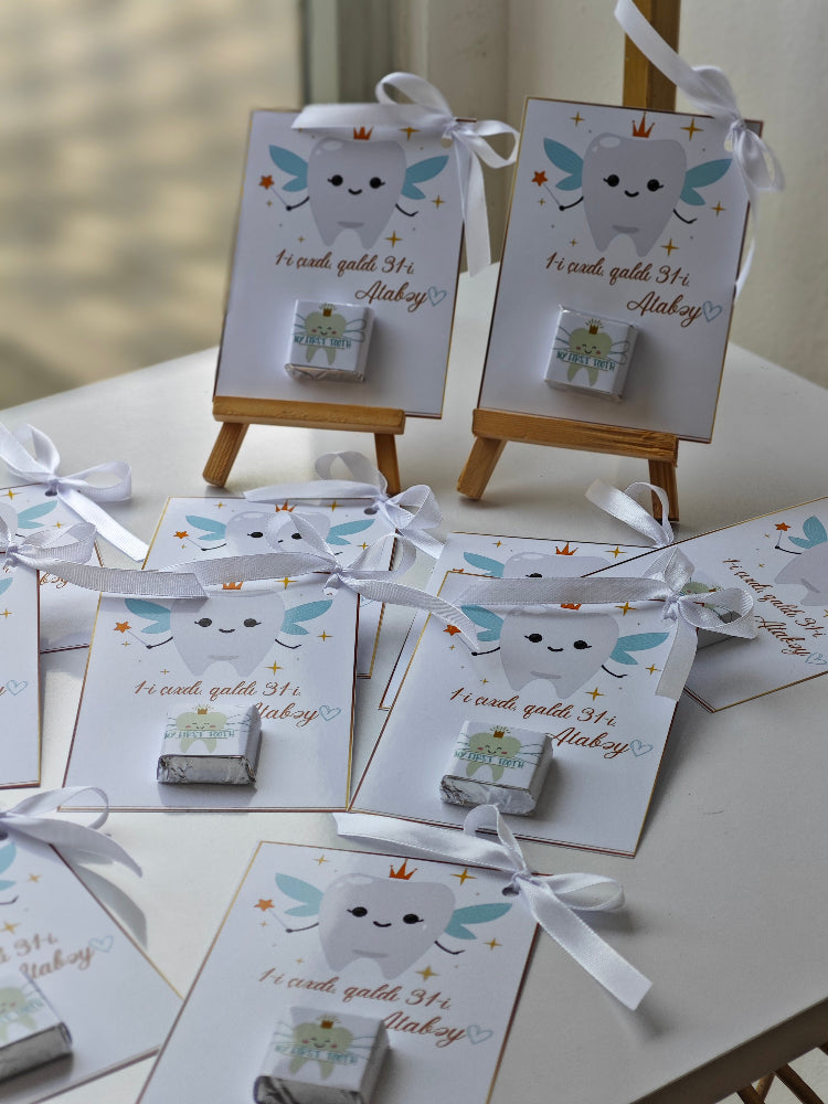 Small boxes with tooth designs on a white surface