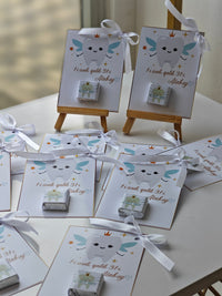 Small boxes with tooth designs on a white surface