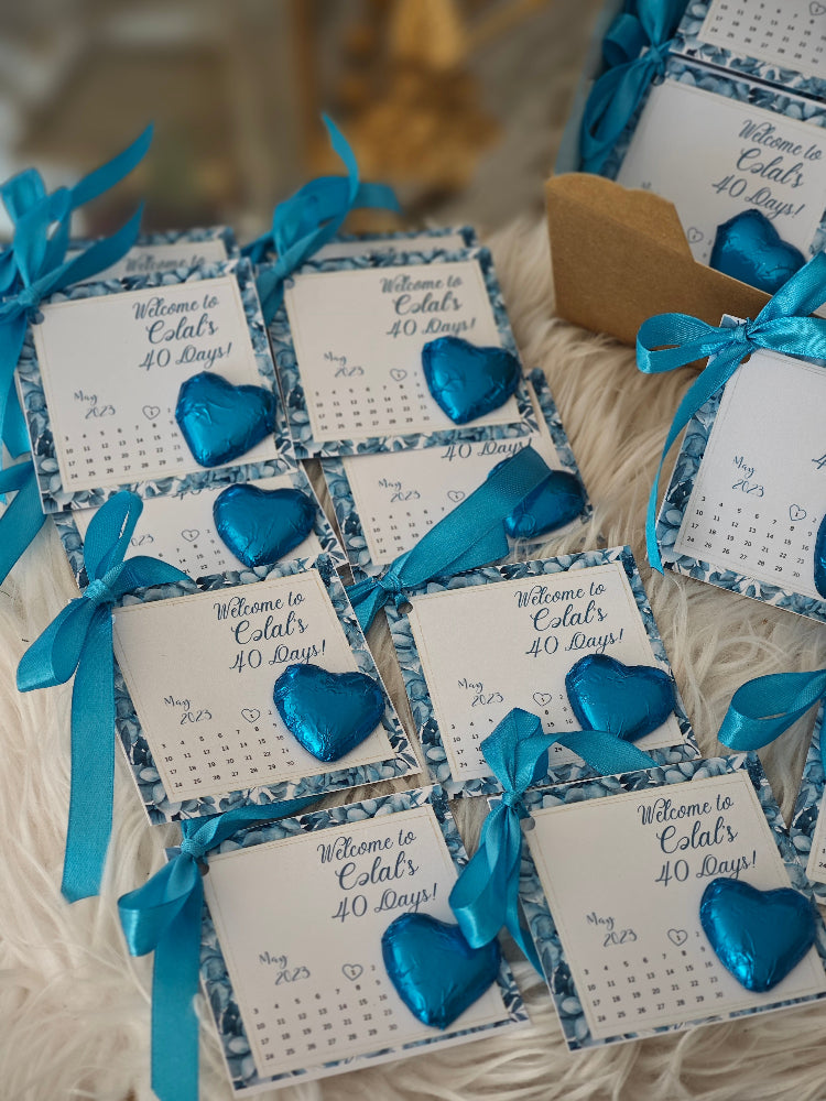 Decorative cards with blue hearts and ribbons on a textured surface