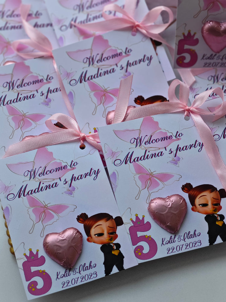 Invitation cards for a birthday party with pink ribbons and decorative elements.