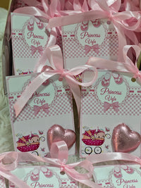 Set of 'Princess Vela' themed cards with pink ribbons and heart-shaped decorations.