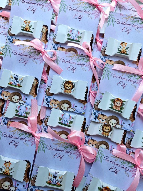 Baby shower favor tags with animal illustrations and pink ribbons on a white background