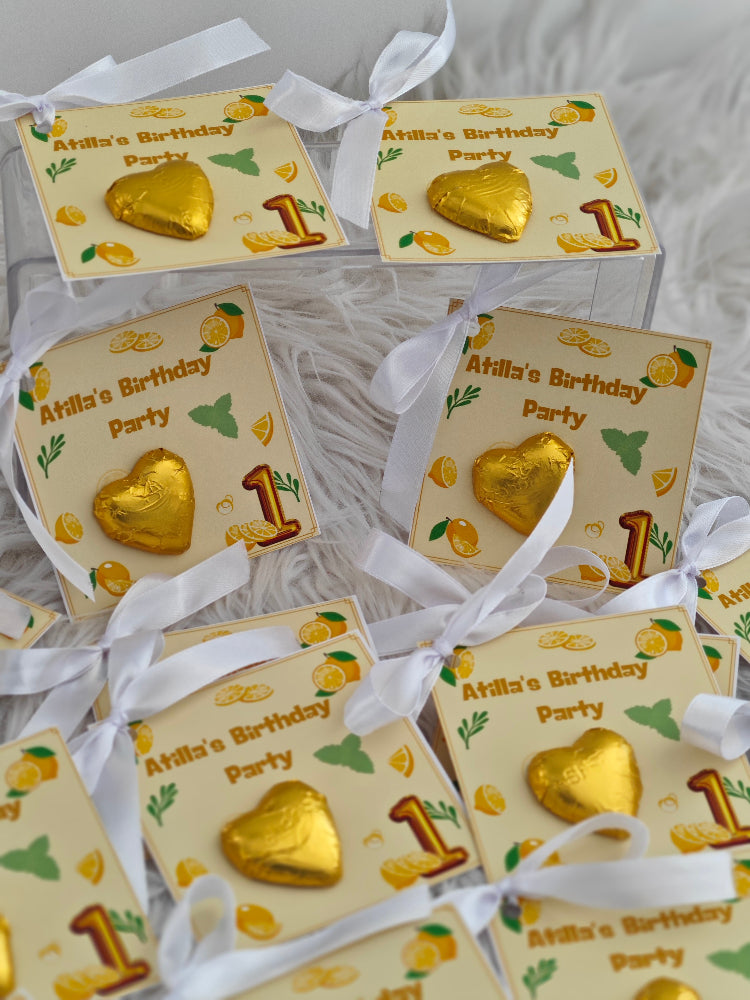 Decorative boxes with gold hearts and 'Atilla's Birthday Party' text on a white background