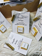 Personalized wedding cards with gold accents on a textured surface
