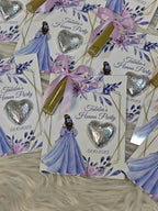 Invitations for a henna party with decorative elements on a textured surface